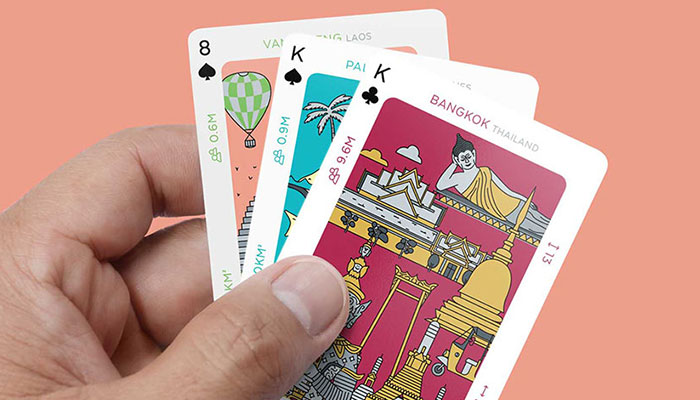 southeast-asia-travel-trumps-and-playing-cards-deck-in-hand-ft